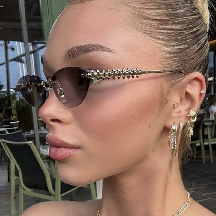 Women's sunglasses in modern, geometric design with stylish metal frame and UV protection Skanto