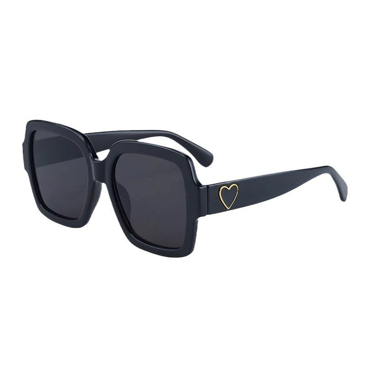 Dame Modemessig solbrille med eksklusiv hjerte-detalj Skanto