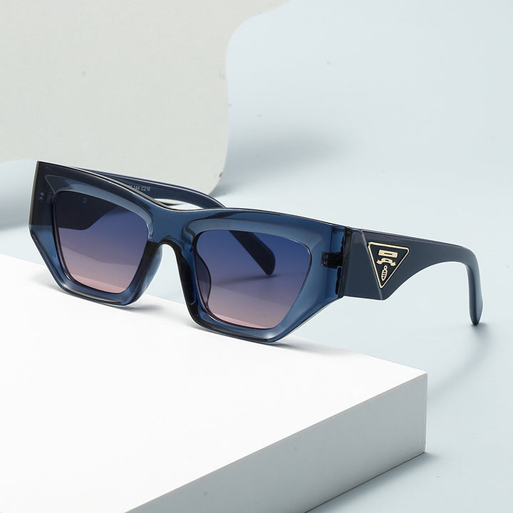 Dame Designer solbrille med moderne, geometrisk ramme Skanto