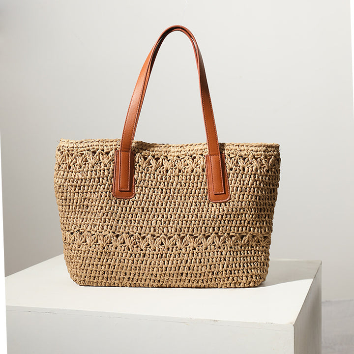 Braided straw basket with sturdy leather handles Skanto