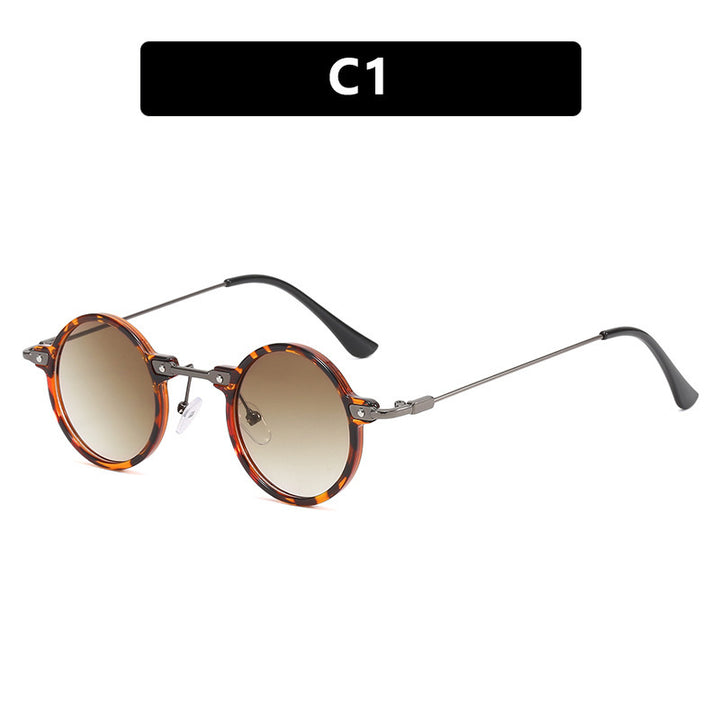 Dame rund solbrille med moderne metallramme og store blå linser Skanto