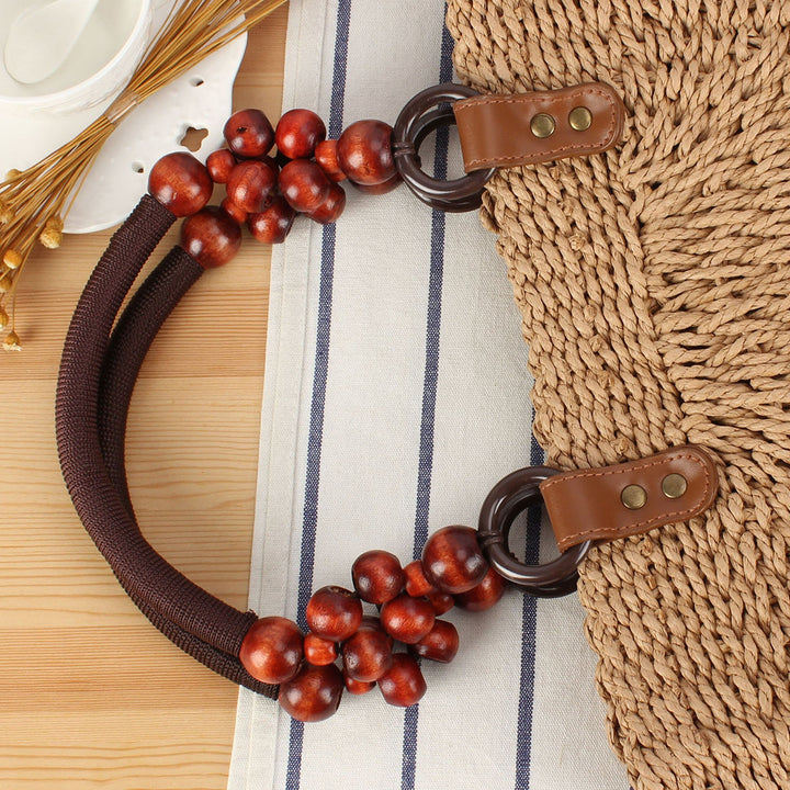 Basket bag with elegant wooden handles and textured surface Skanto