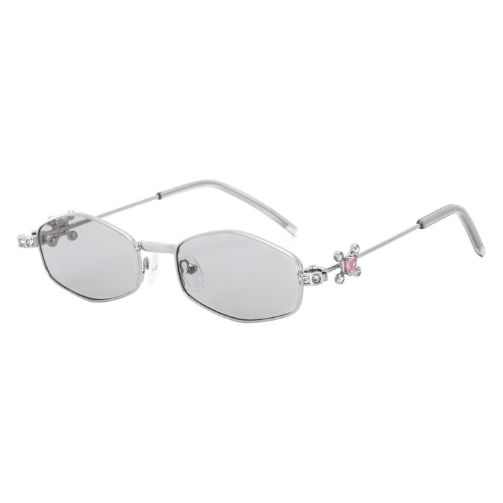 Dame Designer-solbrille med elegant smykkeinnramming Skanto