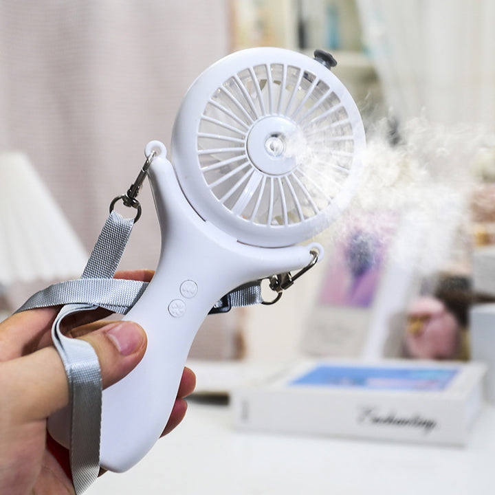 Kvinne bærbar mini håndvifte med sprayfunksjon og ergonomisk design Skanto