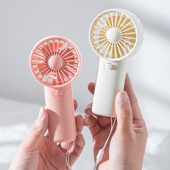 Kvinnenes bærbare mini håndholdte vifte med innovativ luftbevegelse Skanto