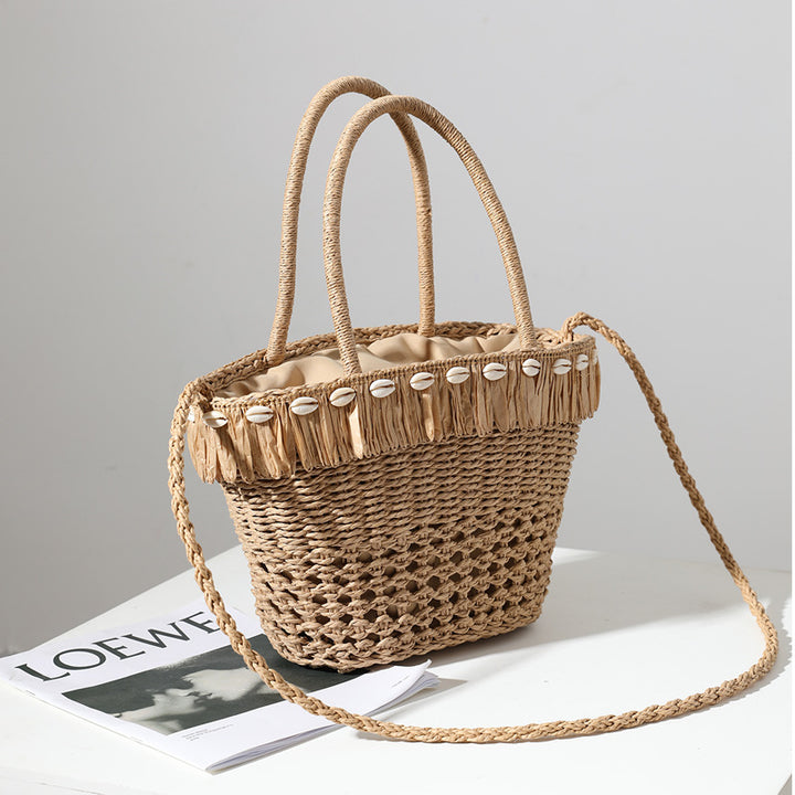 Braided straw bag with decorative tassel detail Skanto