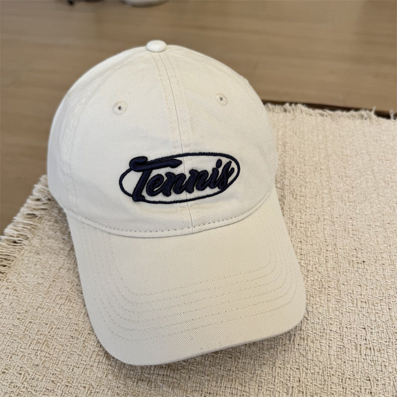 Herresportcaps med tennisgrafikk Skanto