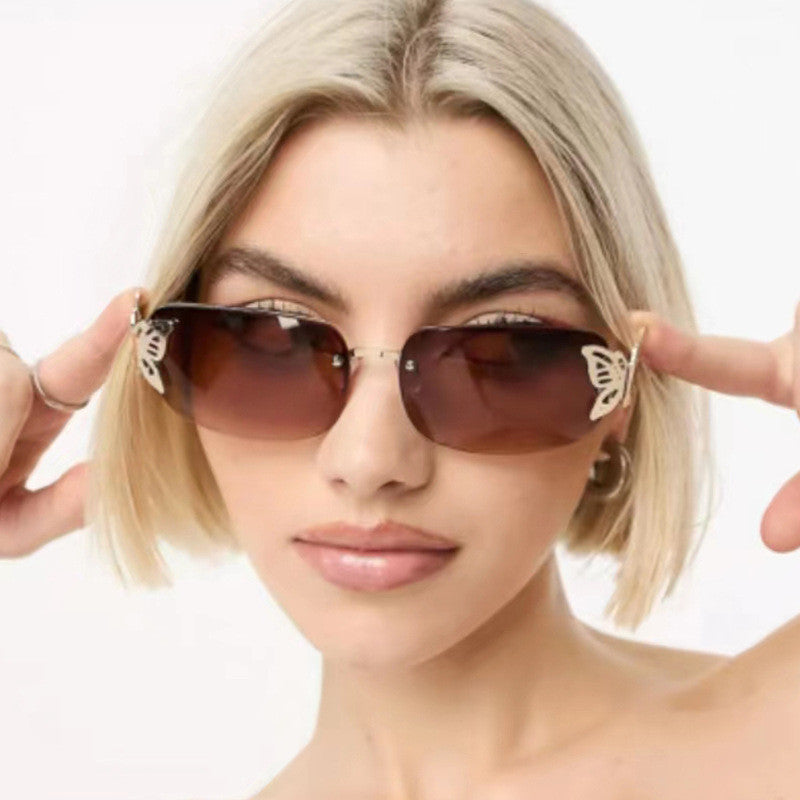 Women's fashionable sunglasses with filigree butterfly design and protective lenses Skanto