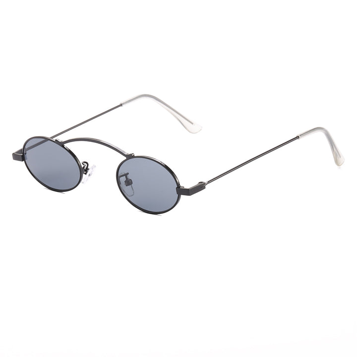 Dame moteriktig solbrille med unike sirkulære rammer og karakteristiske linser Skanto