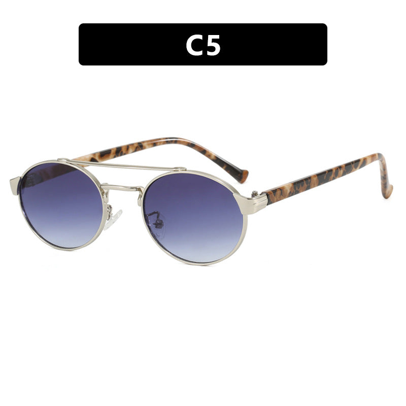 Women's fashionable sunglasses in stylish round design with gold accents Skanto