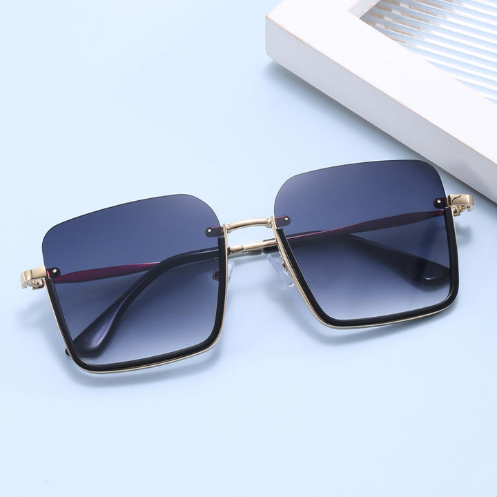 Dame oversized solbrille med elegant geometrisk ramme Skanto