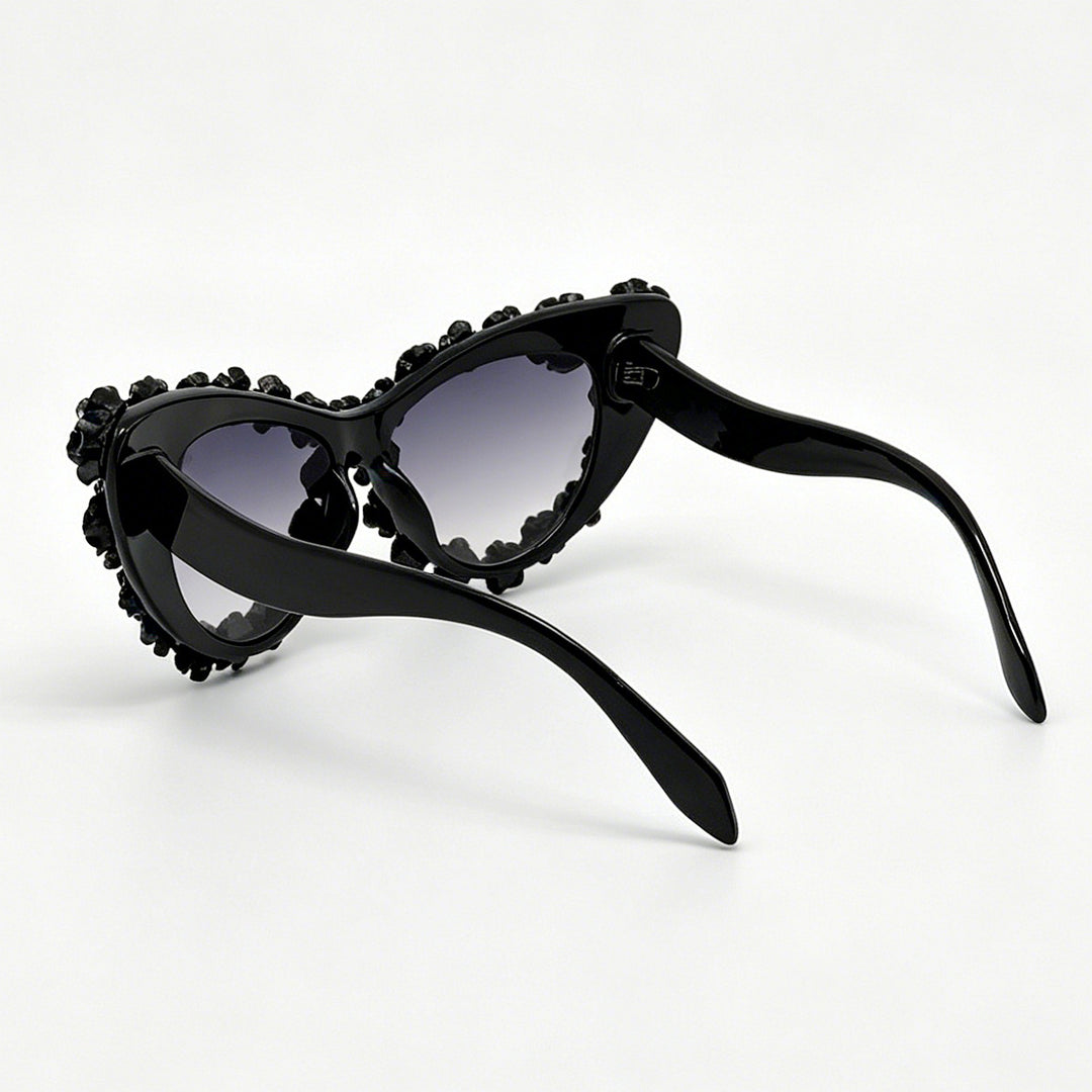 Damen hjerteformet solbrille med blomsterapplikasjon Skanto