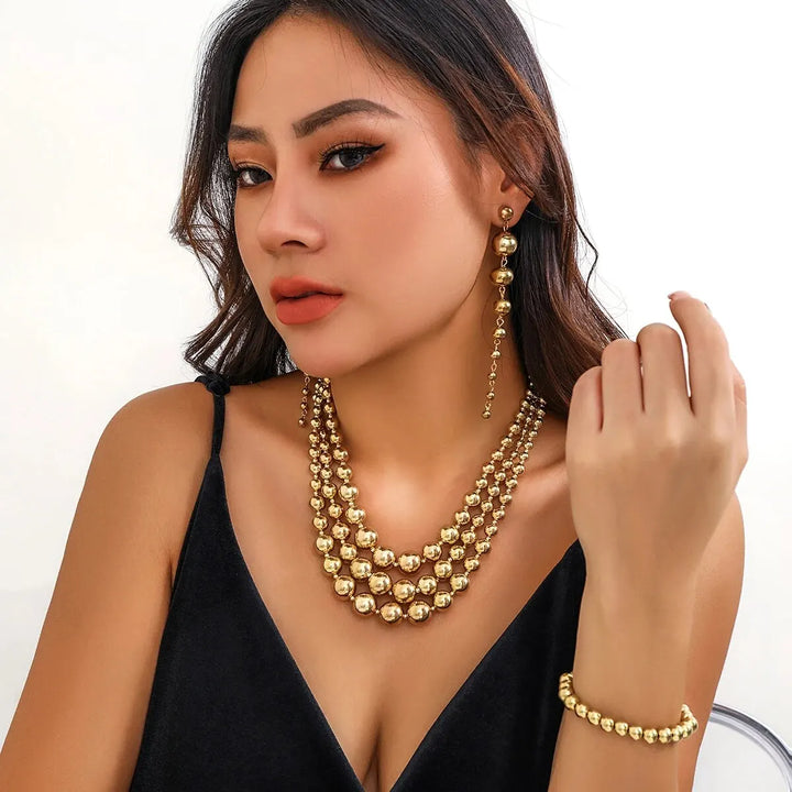 Skanto | Bold Triple Stack Dangle Øredobber, Halskjede, Armbånd Sett