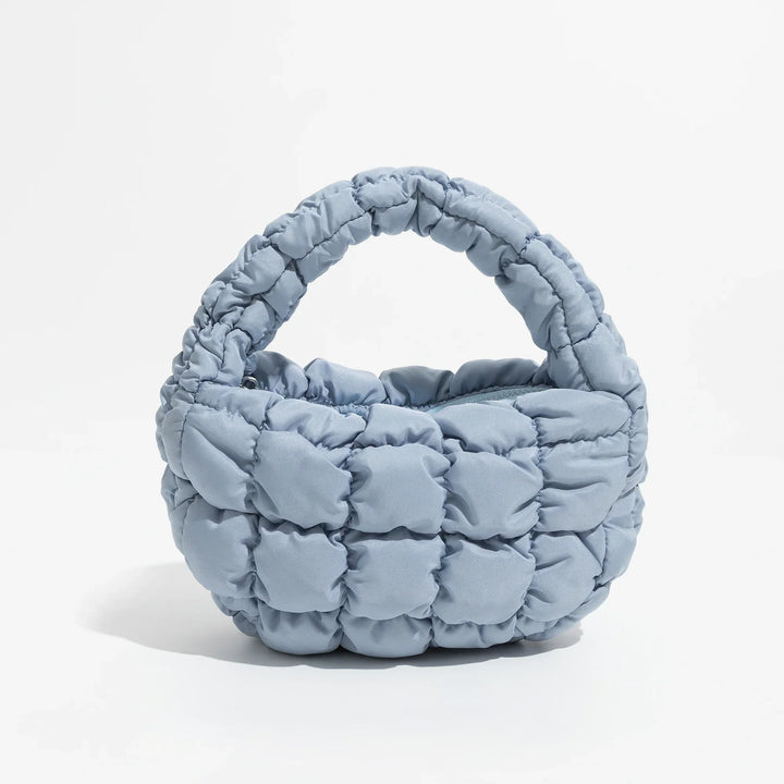 Skanto | Livlig quiltet rund mini bag