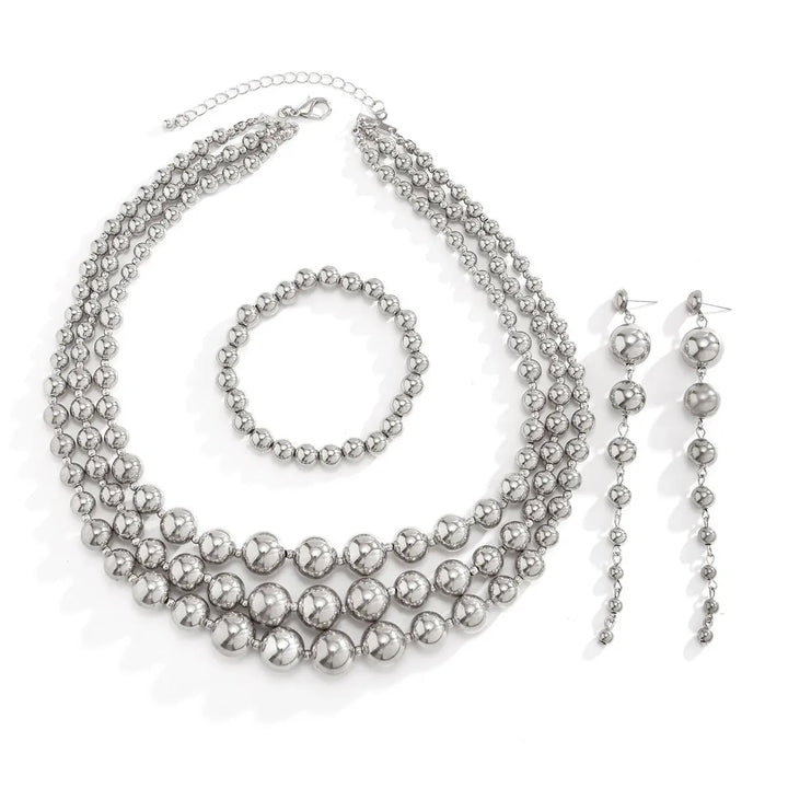 Skanto | Bold Triple Stack Dangle Øredobber, Halskjede, Armbånd Sett