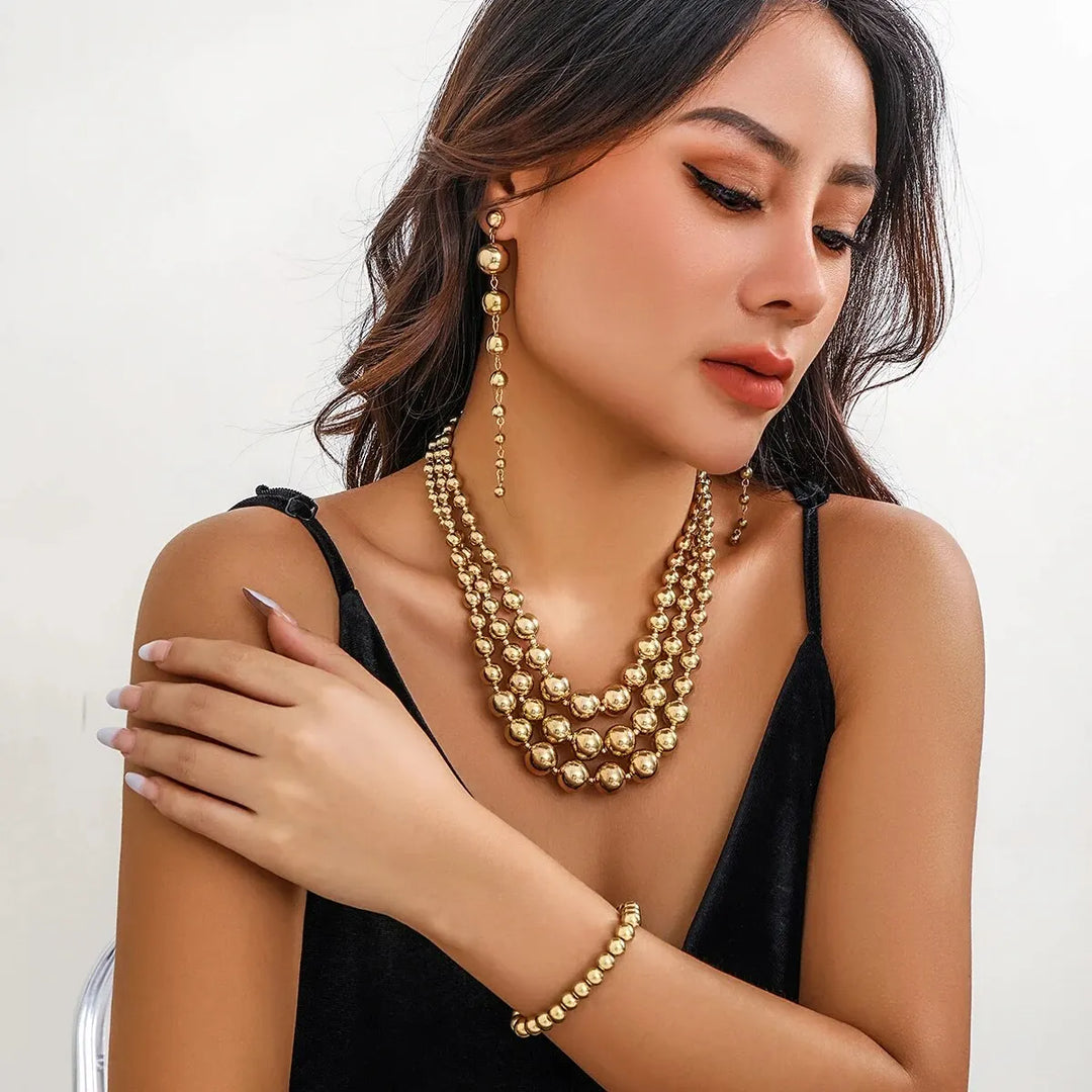 Skanto | Bold Triple Stack Dangle Øredobber, Halskjede, Armbånd Sett