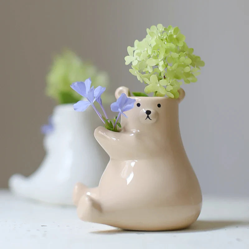 Bjørn med blomsterpotte | Skanto