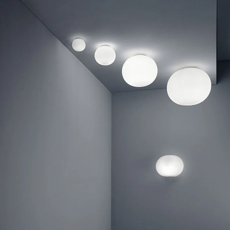 Skanto | GlaciaLuxe – Minimalist Vegglampe med Glass Stein Design
