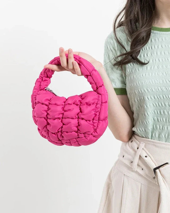 Skanto | Livlig quiltet rund mini bag