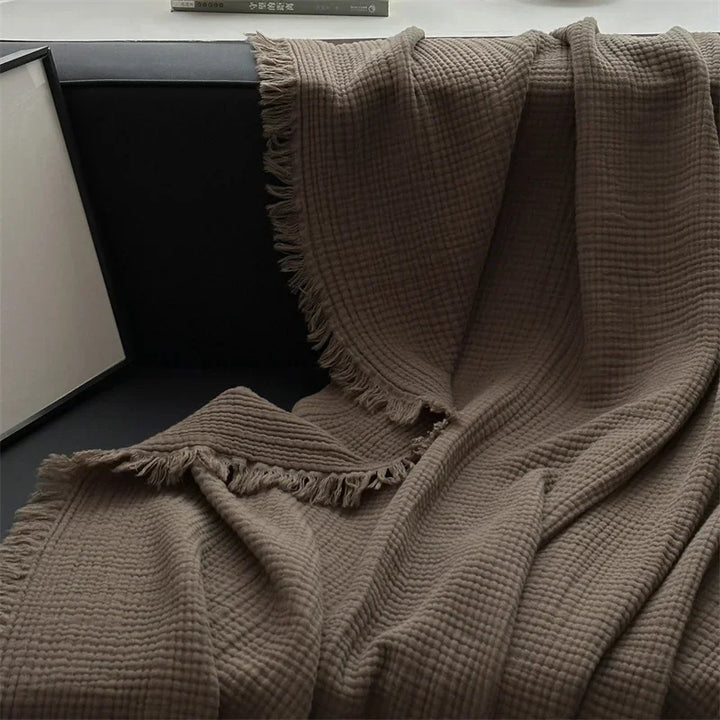 Skanto | Ensfarget bomull sofa teppe