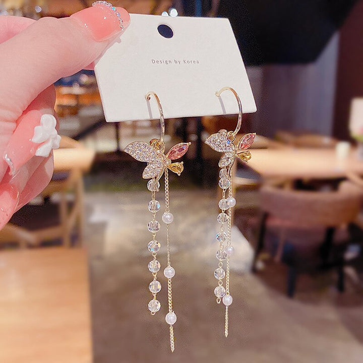 Skanto | Lange Blumen-Kettenohrringe | Elegantes leichtes Hängedesign | Gold