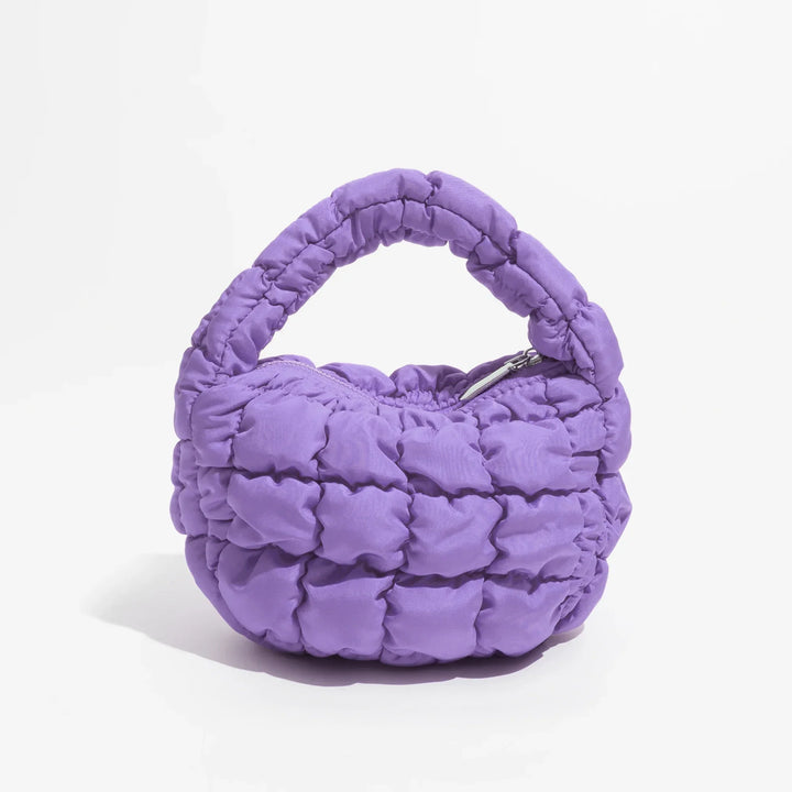 Skanto | Livlig quiltet rund mini bag