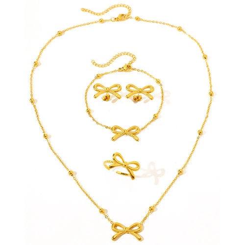 Skanto | Feminine Bow Satellite Chain Necklace, Bracelet, Earrings, and Ring Set