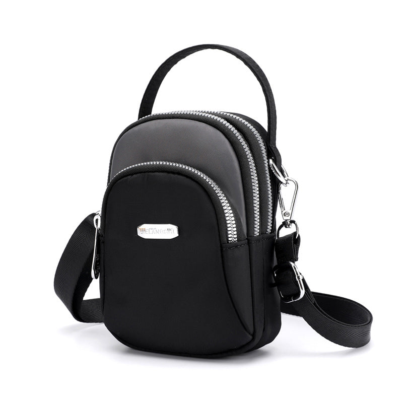 Vanntett liten skulderveske laget av nylon | Skanto