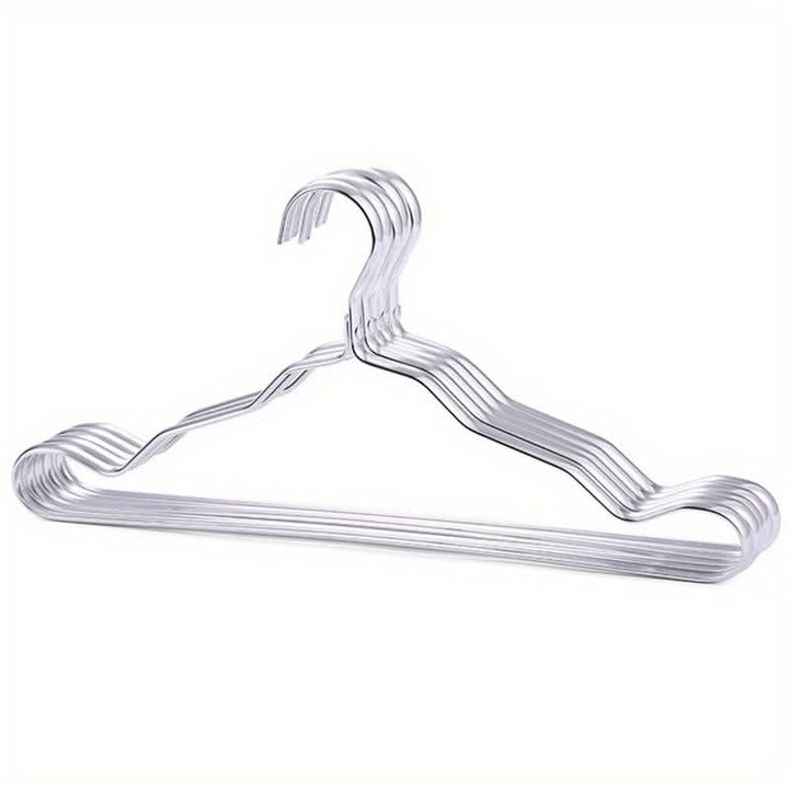 Hochwertige Kleiderbügel fra Messing for elegante Garderobe