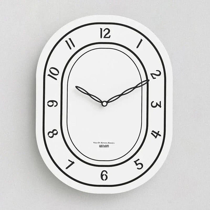 Skanto | Stille oval veggklokke med romerske tall design