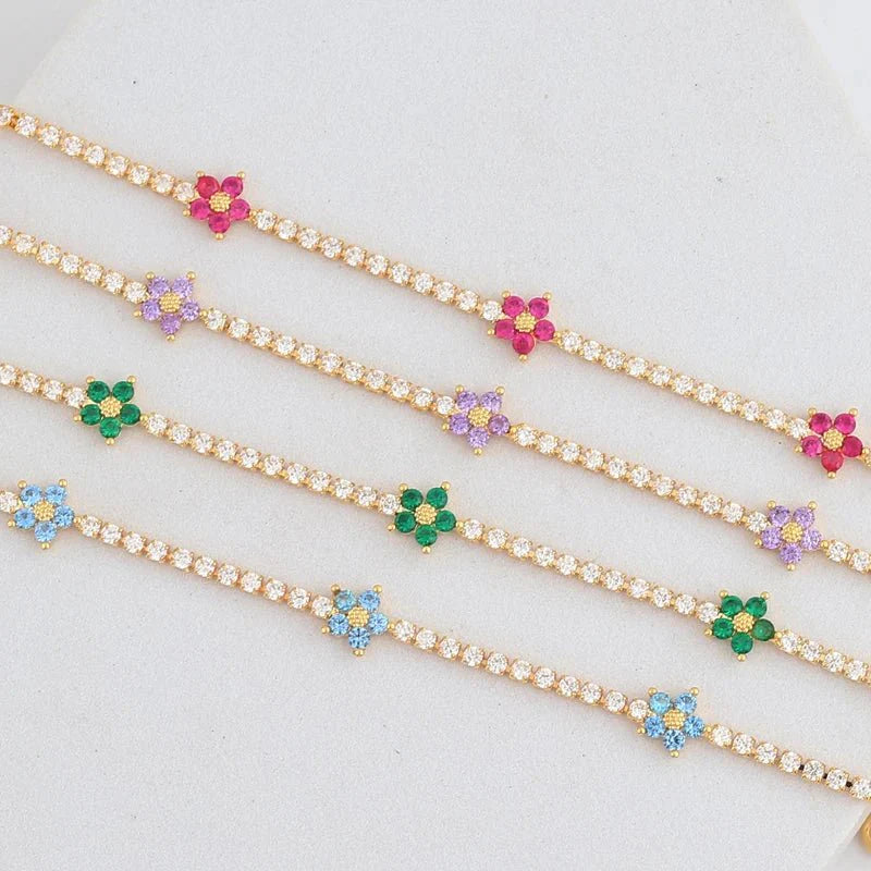Skanto | Delikate diamantblomster armbånd og øredobber