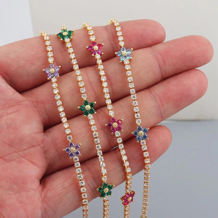 Skanto | Delikate diamantblomster armbånd og øredobber