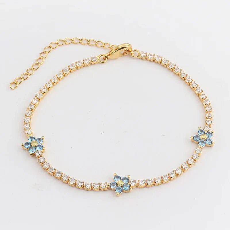 Skanto | Delikate diamantblomster armbånd og øredobber