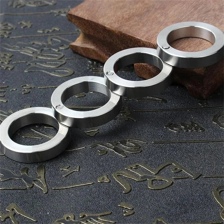 Skanto | DEFENDRING – Taktisk Foldebar Selvforsvar Ring med Rotasjonsvennlig Rustfritt Stål Design