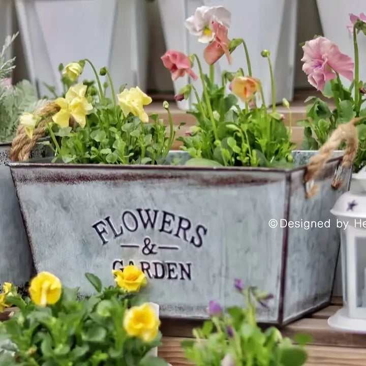 Skanto | Dekorativ blomster- og hagebeholder laget av metall med hemp tauhåndtak