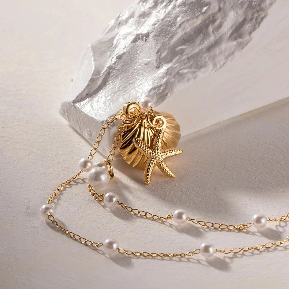 Skanto | Elegante Delikate Spaced Perle Musling Smykke