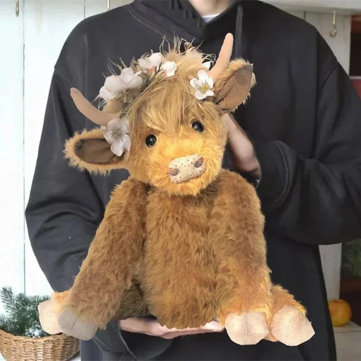 Skanto | Håndlaget Highland Cow Plush med blomsterhodeplagg