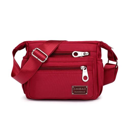 Skanto | Kvinners Multi-lags Nylon Crossbody Bag