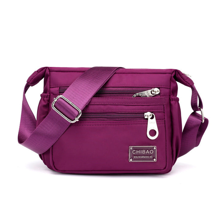 Skanto | Kvinners Multi-lags Nylon Crossbody Bag