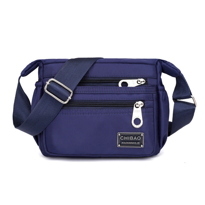 Skanto | Kvinners Multi-lags Nylon Crossbody Bag