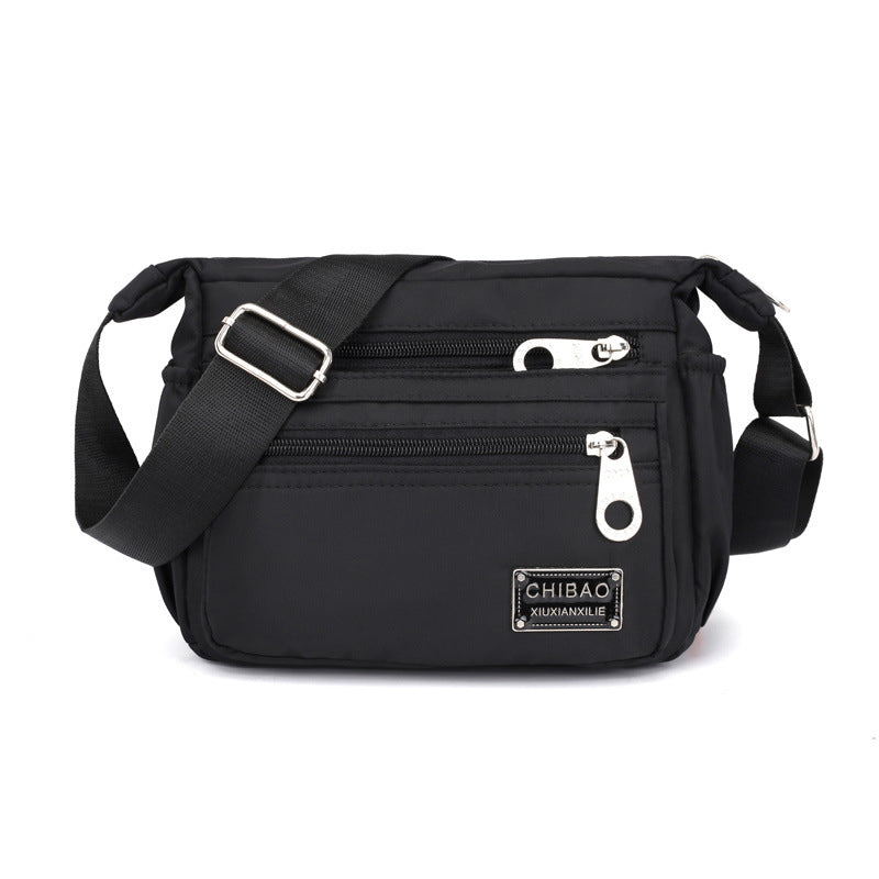 Skanto | Kvinners Multi-lags Nylon Crossbody Bag