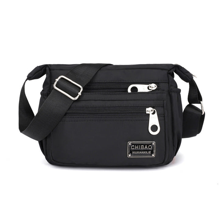 Skanto | Kvinners Multi-lags Nylon Crossbody Bag