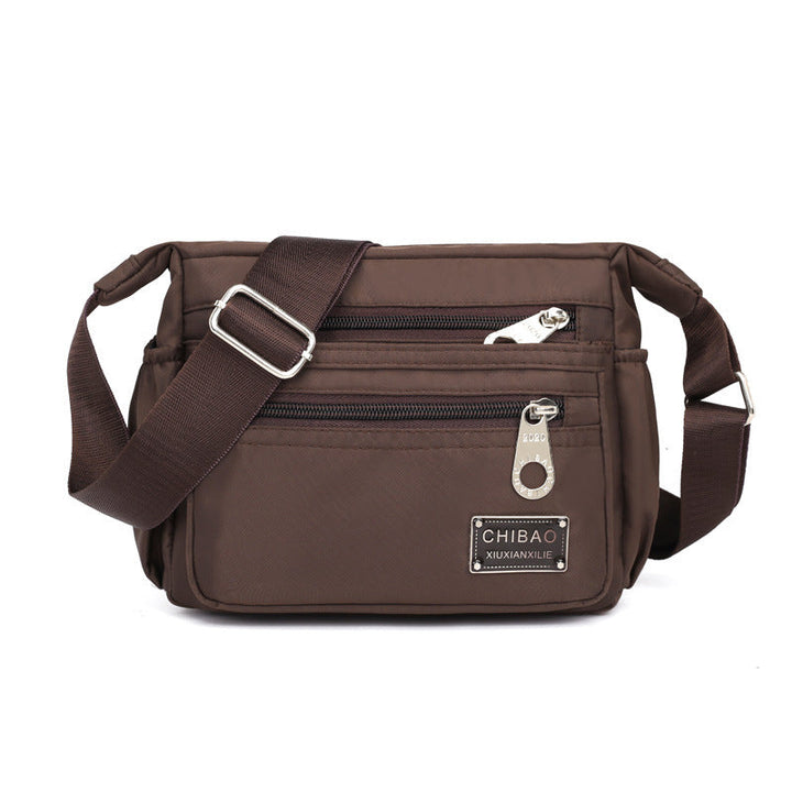 Skanto | Kvinners Multi-lags Nylon Crossbody Bag