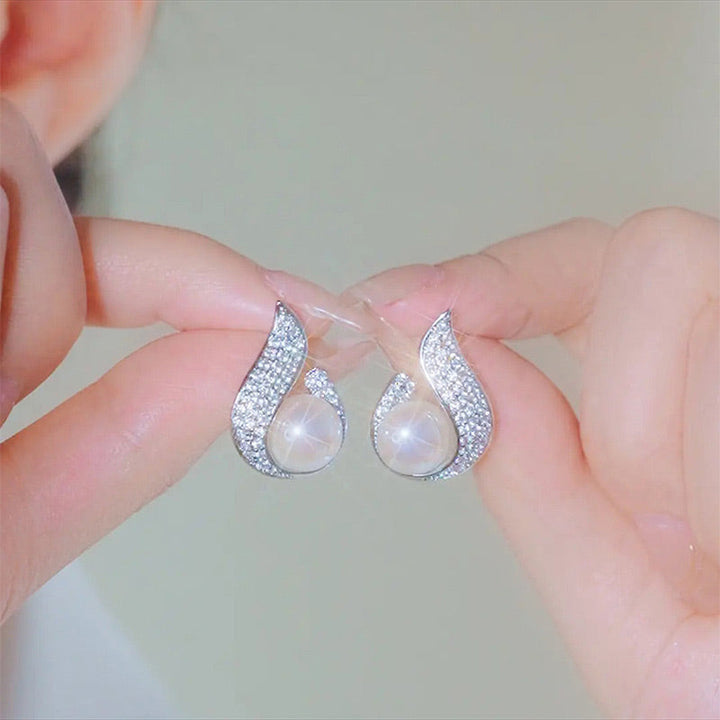 Skanto | Elegante øredobber med perleimitasjon og rhinestone